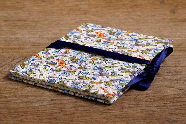 Mini photo album with colorful Florentine paper and blue ribbon to tie